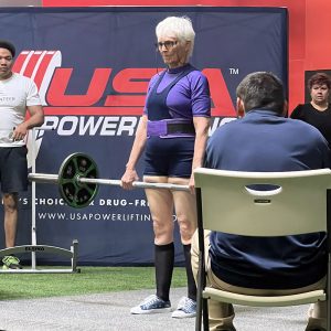 Faith O'Reilly deadlifts at a USA Powerlifting meet.